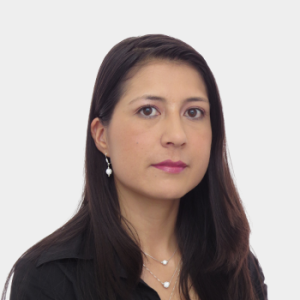 The professor in the Department of Basic Sciences, Julie Fernanda Benavides Arévalo, is presented to the general public and the educational community. The photo was taken in close-up, with a white background, and the professor is centered.