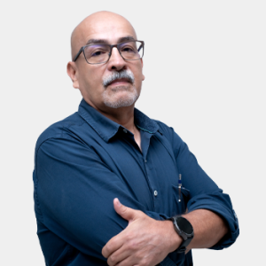 The photo was taken in the foreground, white background and Professor Juan Carlos Muñoz is located in the centre.